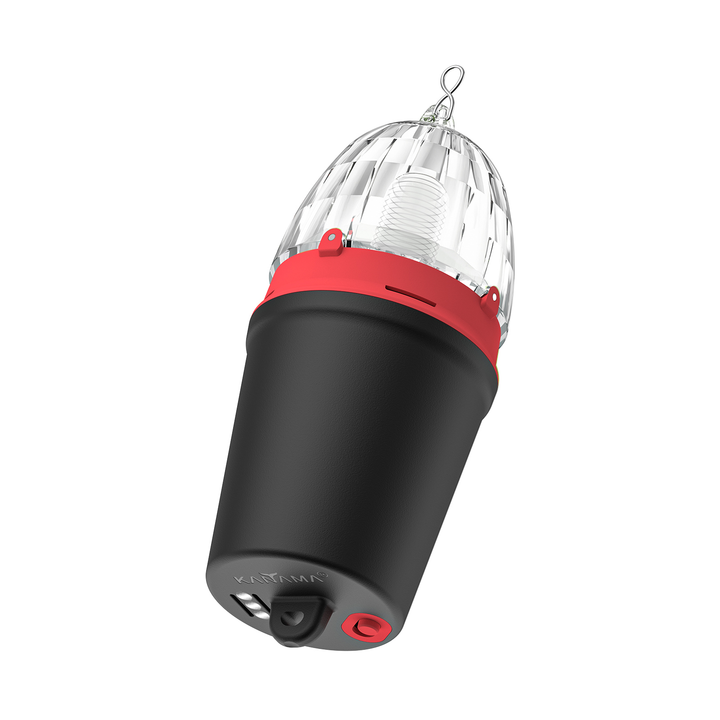 A Kanama portable lighting device. The key features include a clear, protective dome-shaped lens housing, a dark-colored main body, and prominent red accents on the handles and controls. 